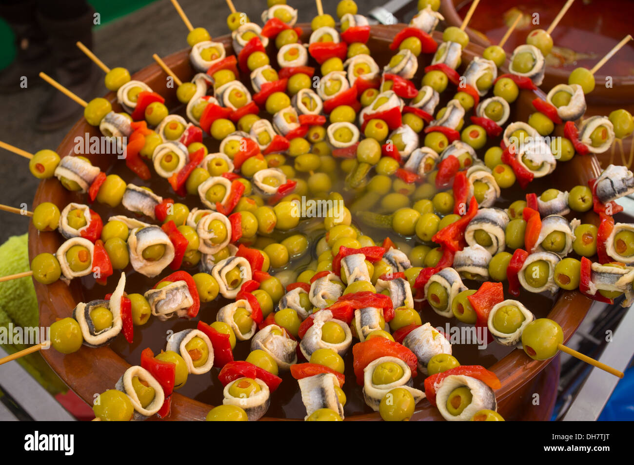 Skewered stuffed olives with anchovies and peppers, a Spanish classic