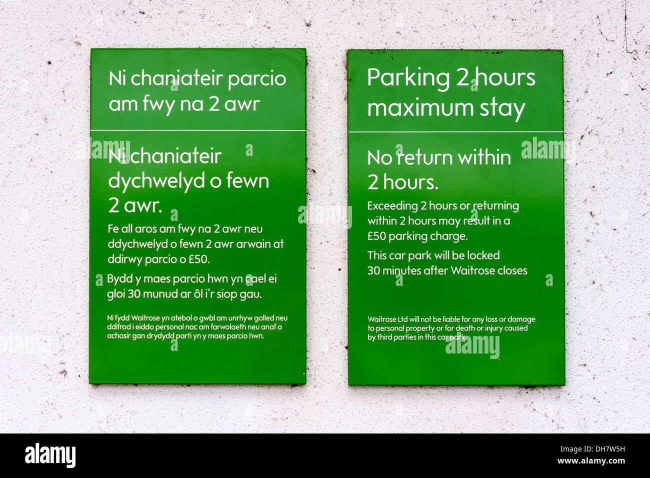 Car parking time limit signs in both English and Welsh in a Waitrose