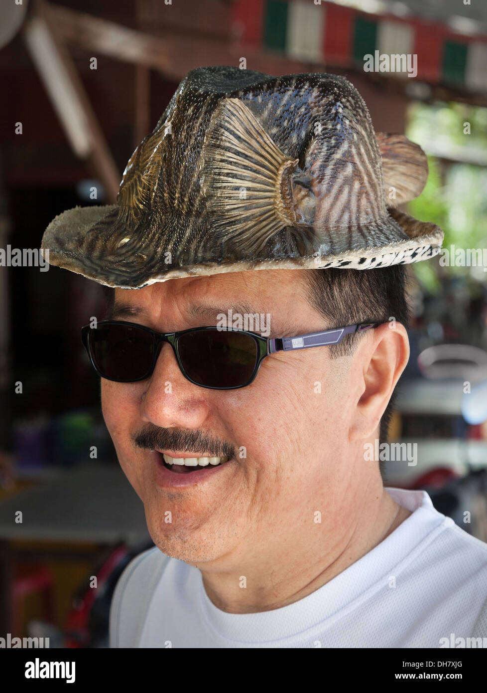 Gentleman's hat made from dried locally caught fish, preserved, a popular tourist craft found in Pulau Pangkor, Malaysia Stock Photo