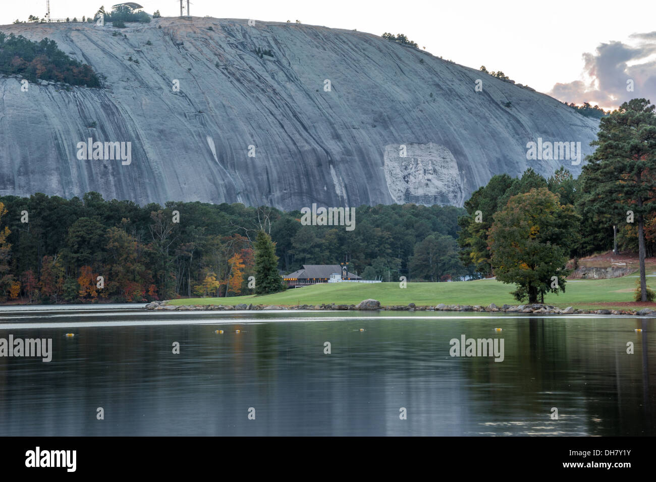 Autumn lake view at dusk of Stone Mountain Park with Confederate Memorial Carving, golf course, riverboat, and Summit Skyride. (USA) Stock Photo