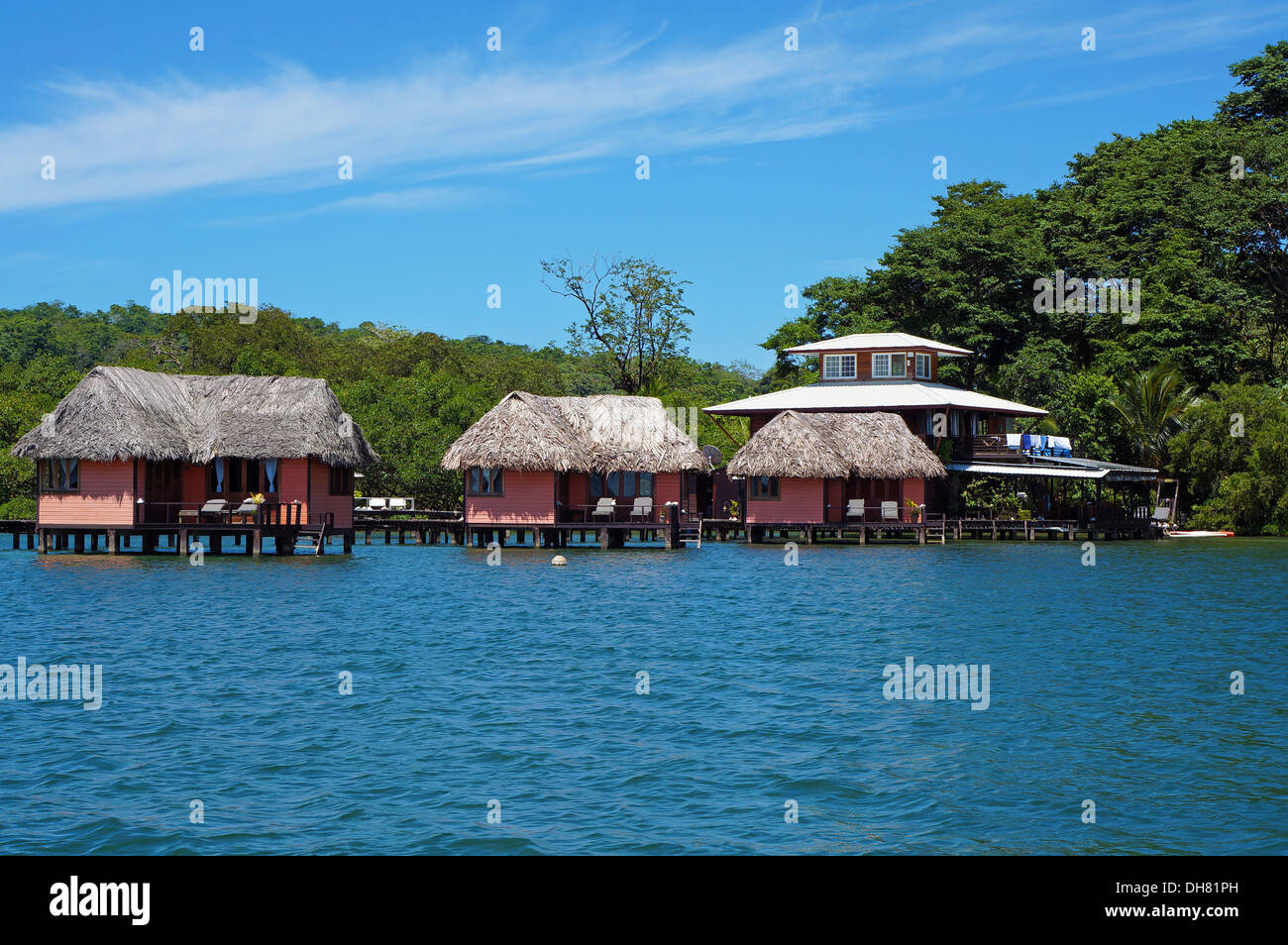 Eco resort with thatched bungalow over water, island of Bastimentos, Caribbean sea, Bocas del Toro, Panama Stock Photo