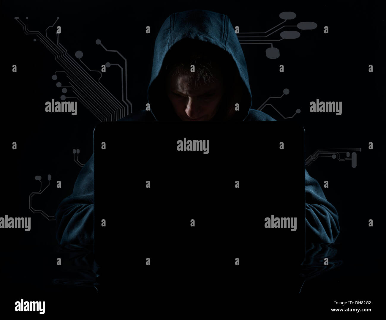 Concept photo of a computer hacker in a hoodie Stock Photo