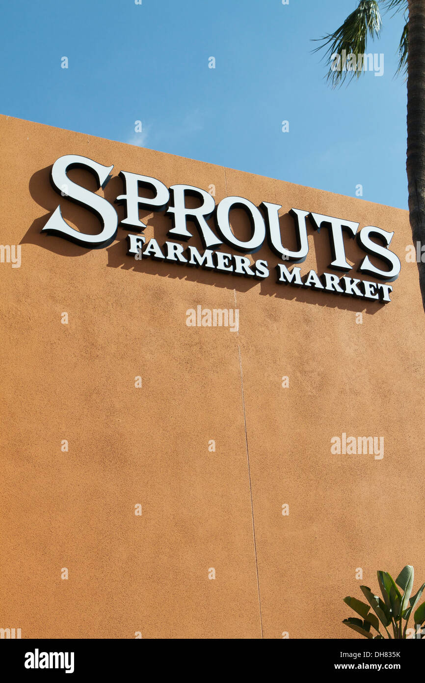 Sprouts neighborhood farmers market grocery store front and logo in