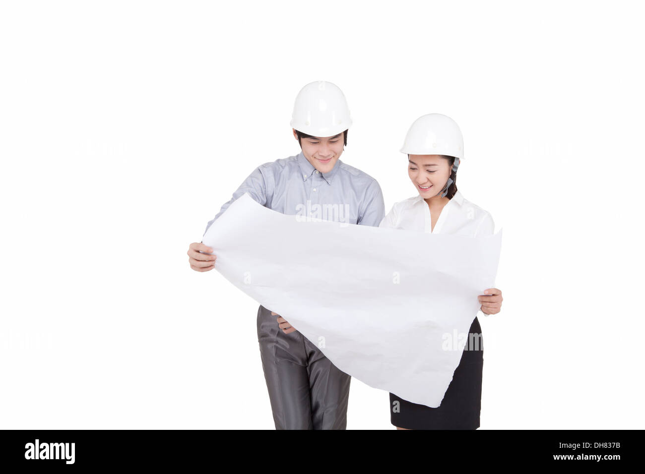 Business people wearing helmets Stock Photo