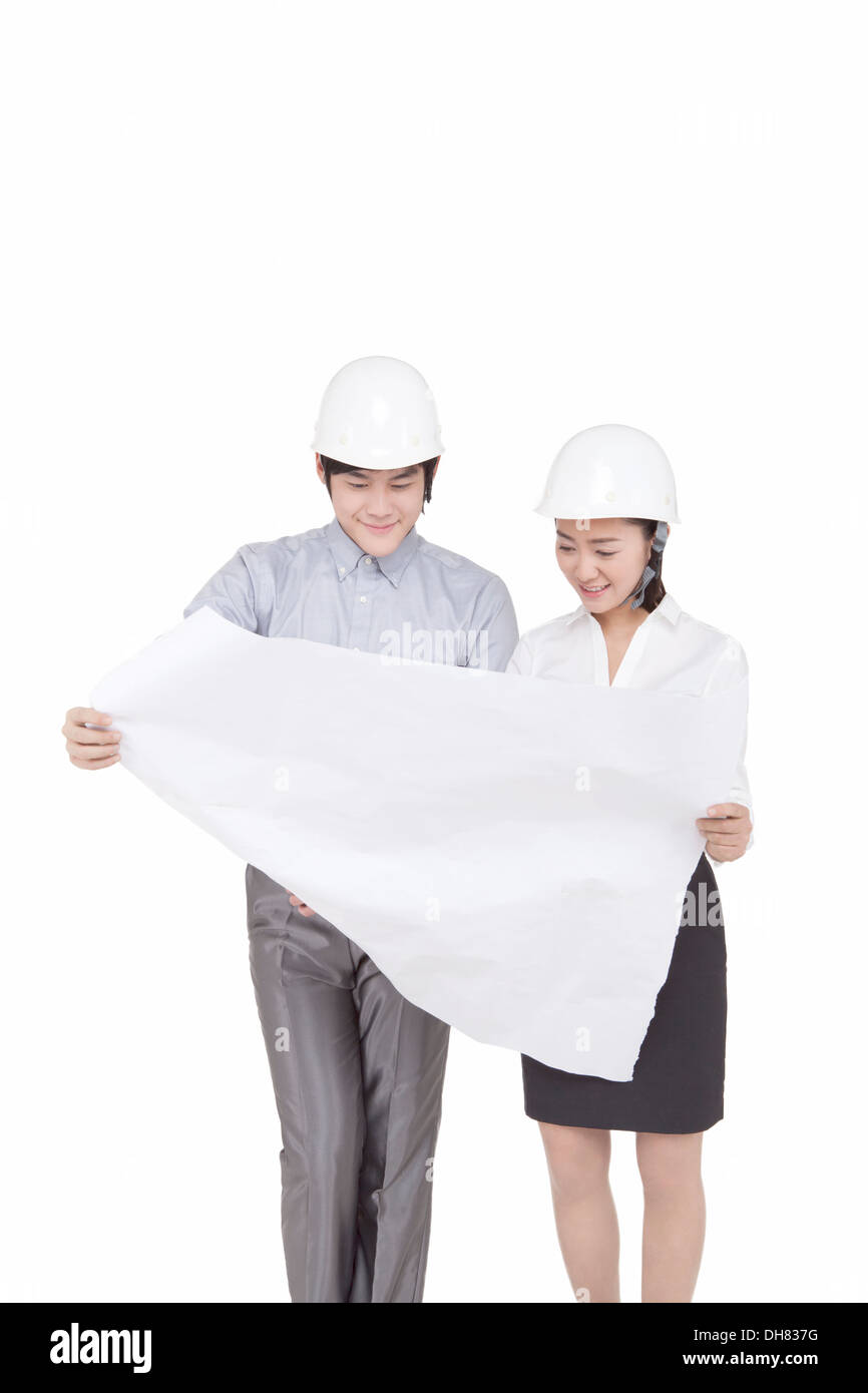 Business people wearing helmets Stock Photo