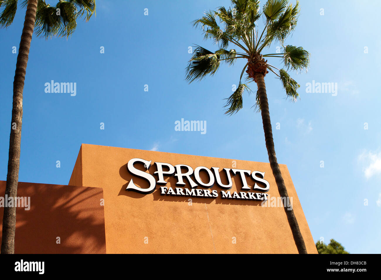 Sprouts neighborhood farmers market grocery store front and logo in