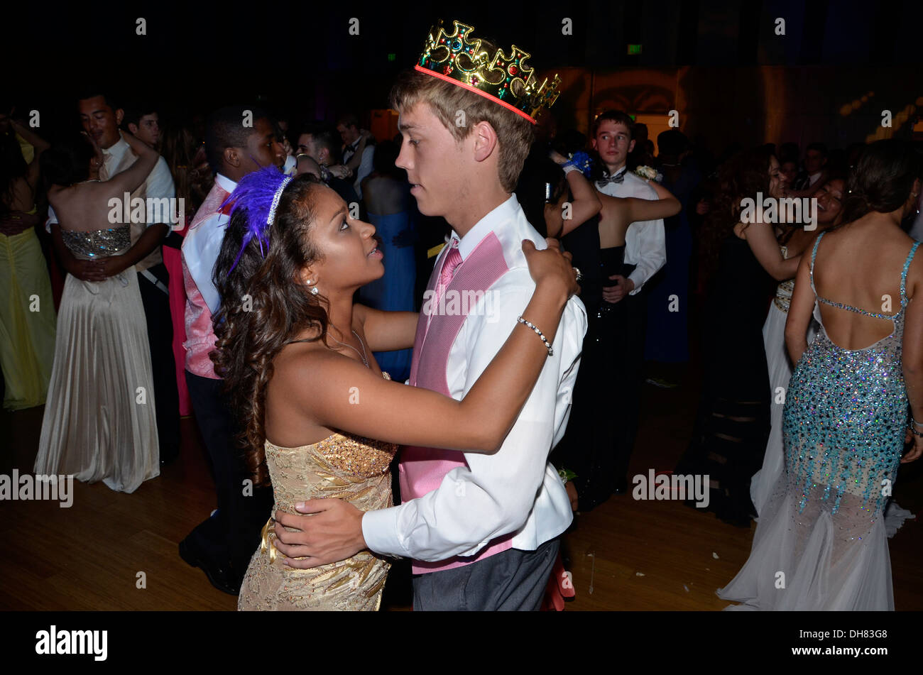 High school prom king dances with his girlfriend Stock Photo