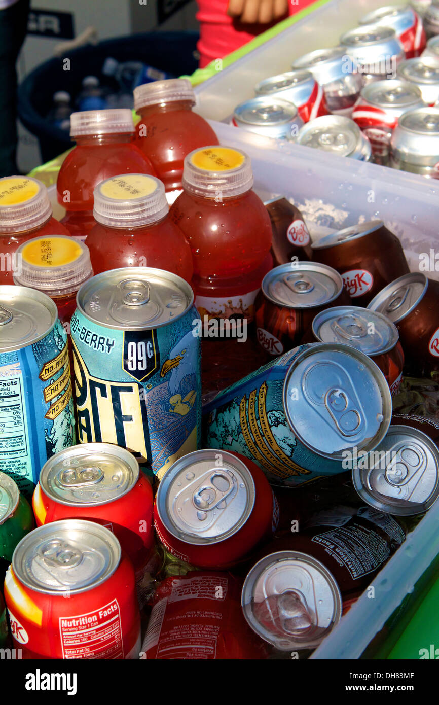 Trays of cold beverages drinks and sodas in iced water at an outdoor