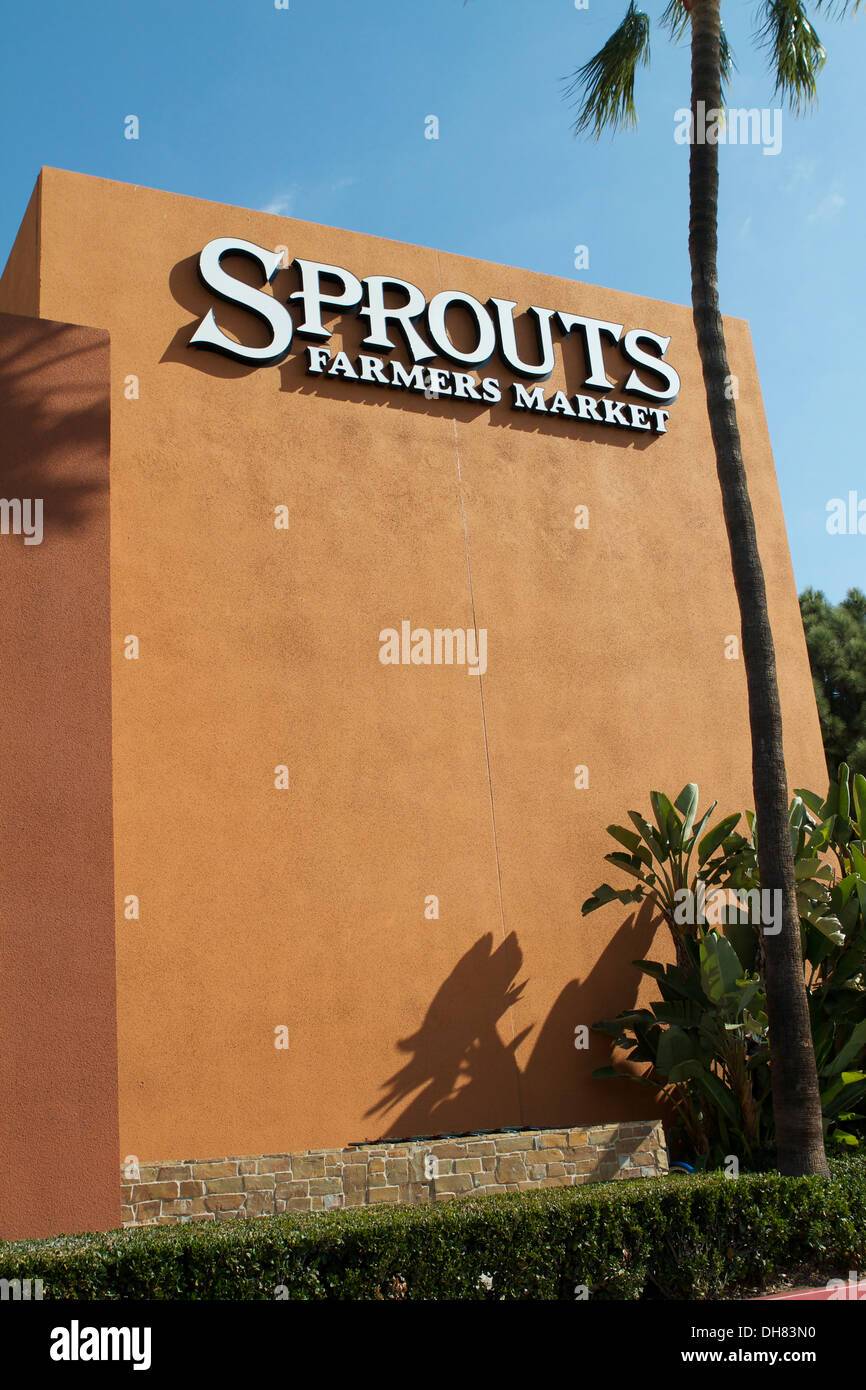 Sprouts neighborhood farmers market grocery store front and logo in