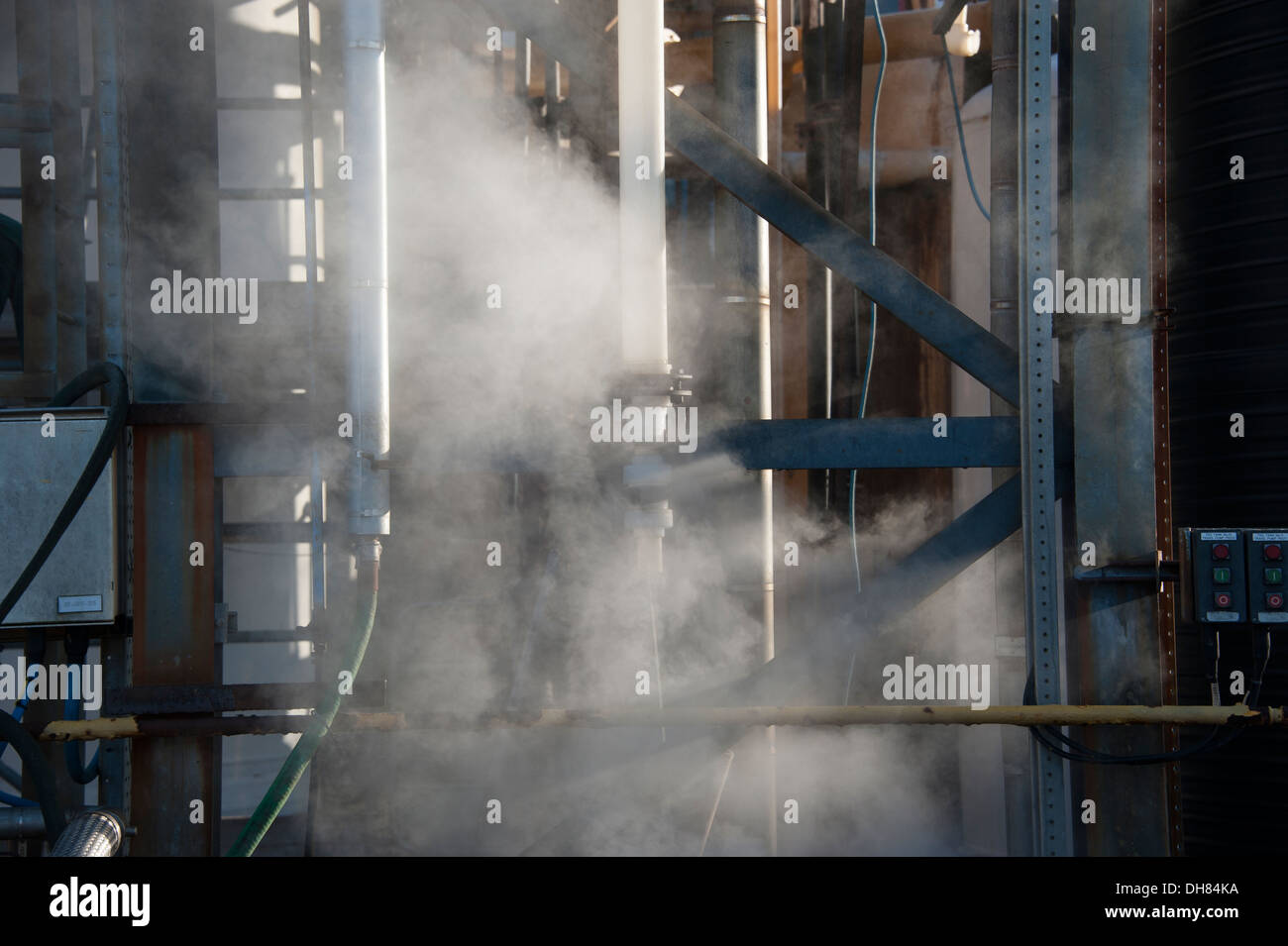 Steam from Factory Processing Plant Pipework cold day Stock Photo