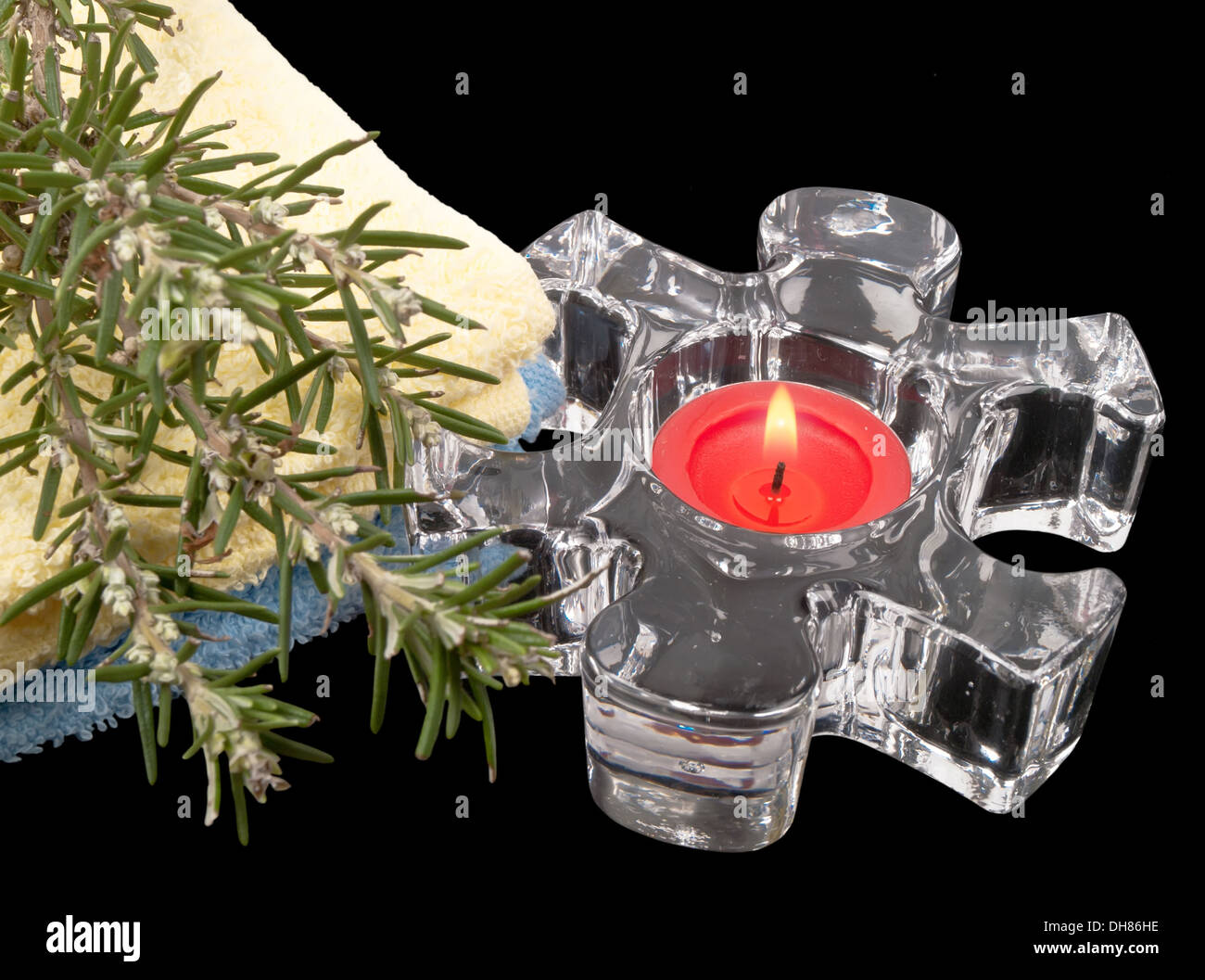 tranquil scene with candle and rosemary Stock Photo