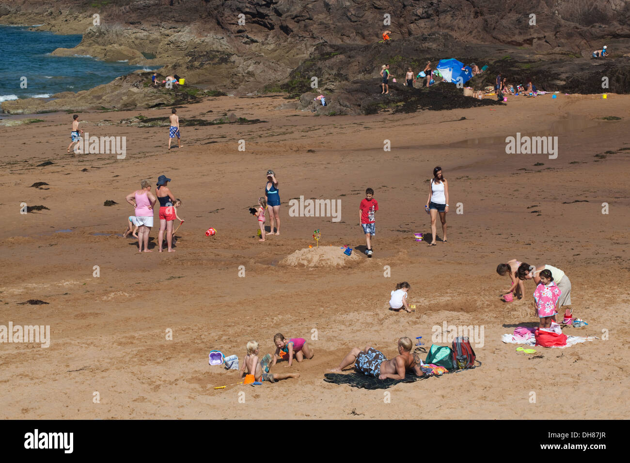 Greve de Lecq. Beach. St. Mary. North coast. Jersey, Channel Islands. England. UK. Holiday makers relaxing and enjoying beach. Stock Photo