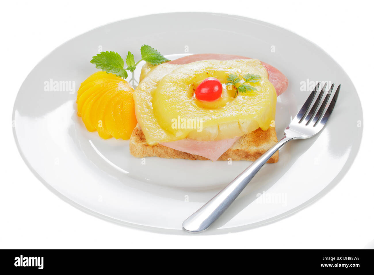 Toast 'Hawaii' with ham, pineapple, cheese, cocktail cherry and peach segments Stock Photo