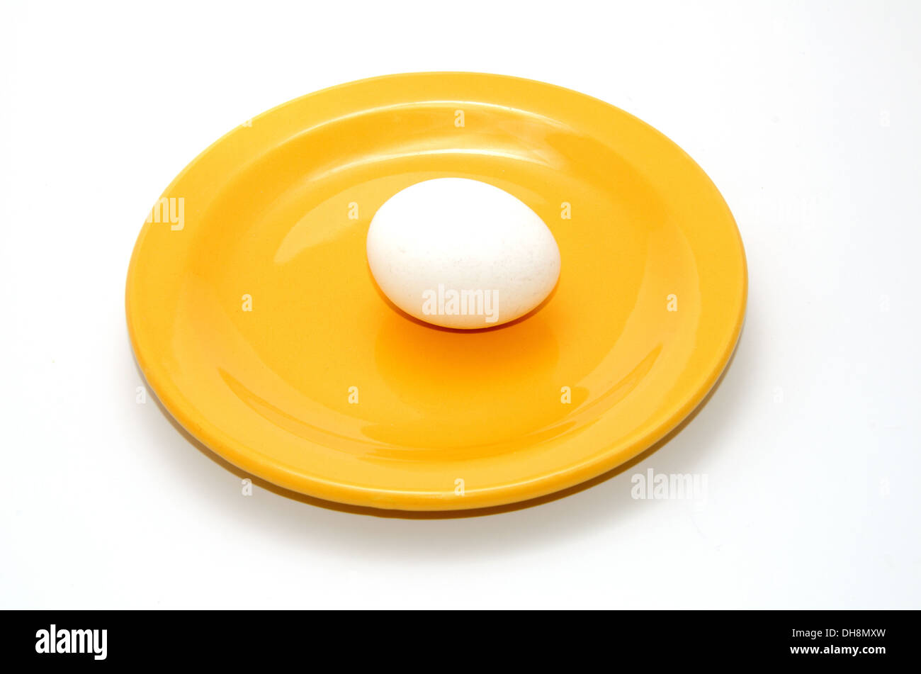 Yellow plate with egg white Stock Photo Alamy