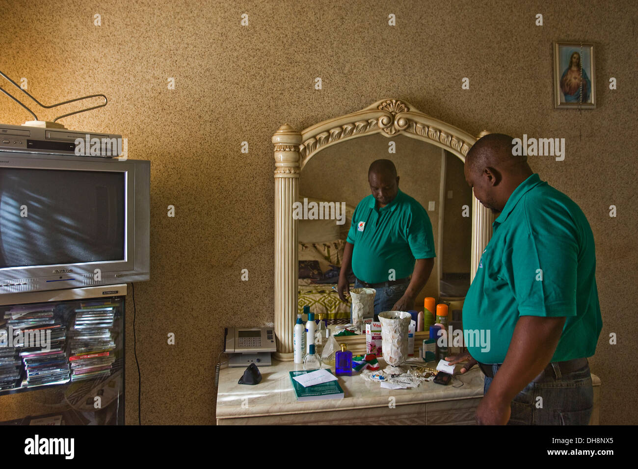 Brick Mololo, former South Africa football legend and ANC activist, works in Orange Farm as a waste collector. He gets ready Stock Photo