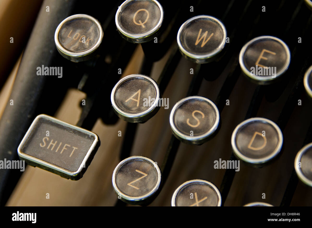 Closeup of antique typewriter keys, including the shift key Stock Photo