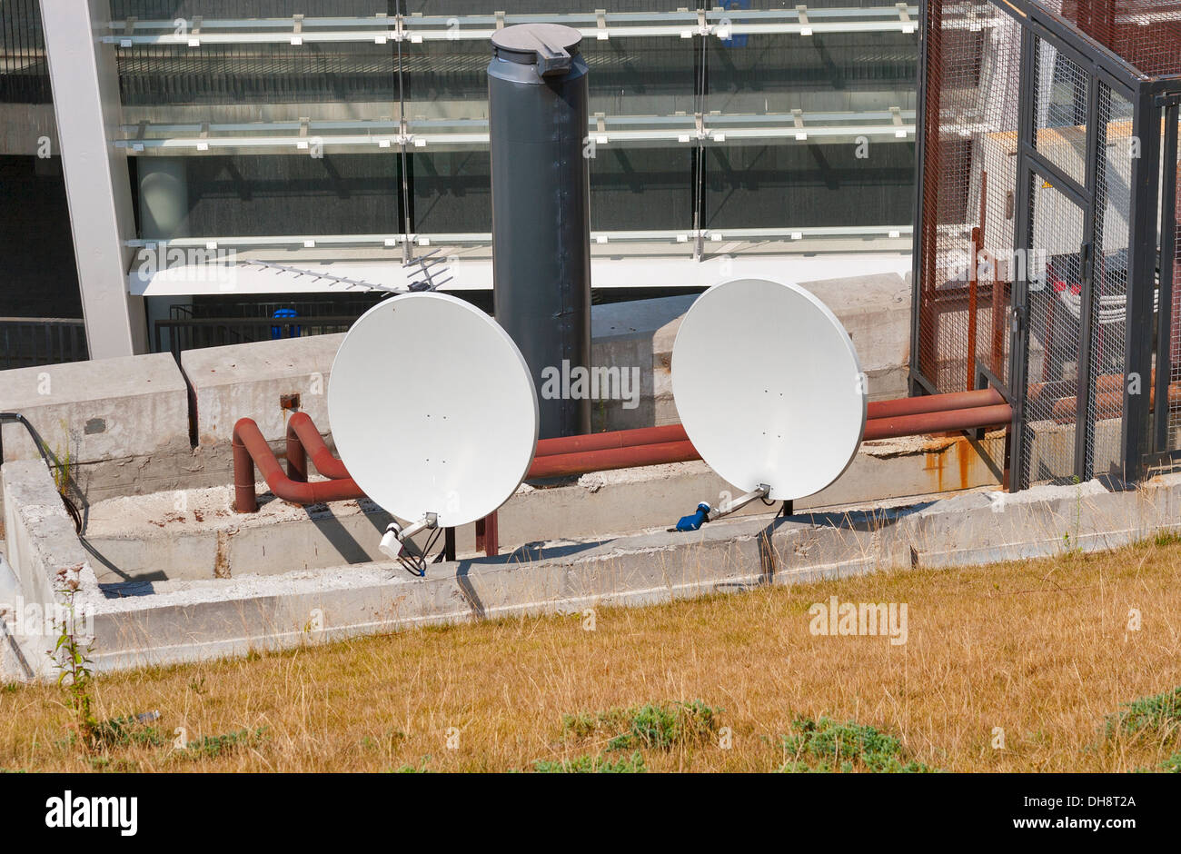 Two satellite dishes in an industrial environment Stock Photo Alamy