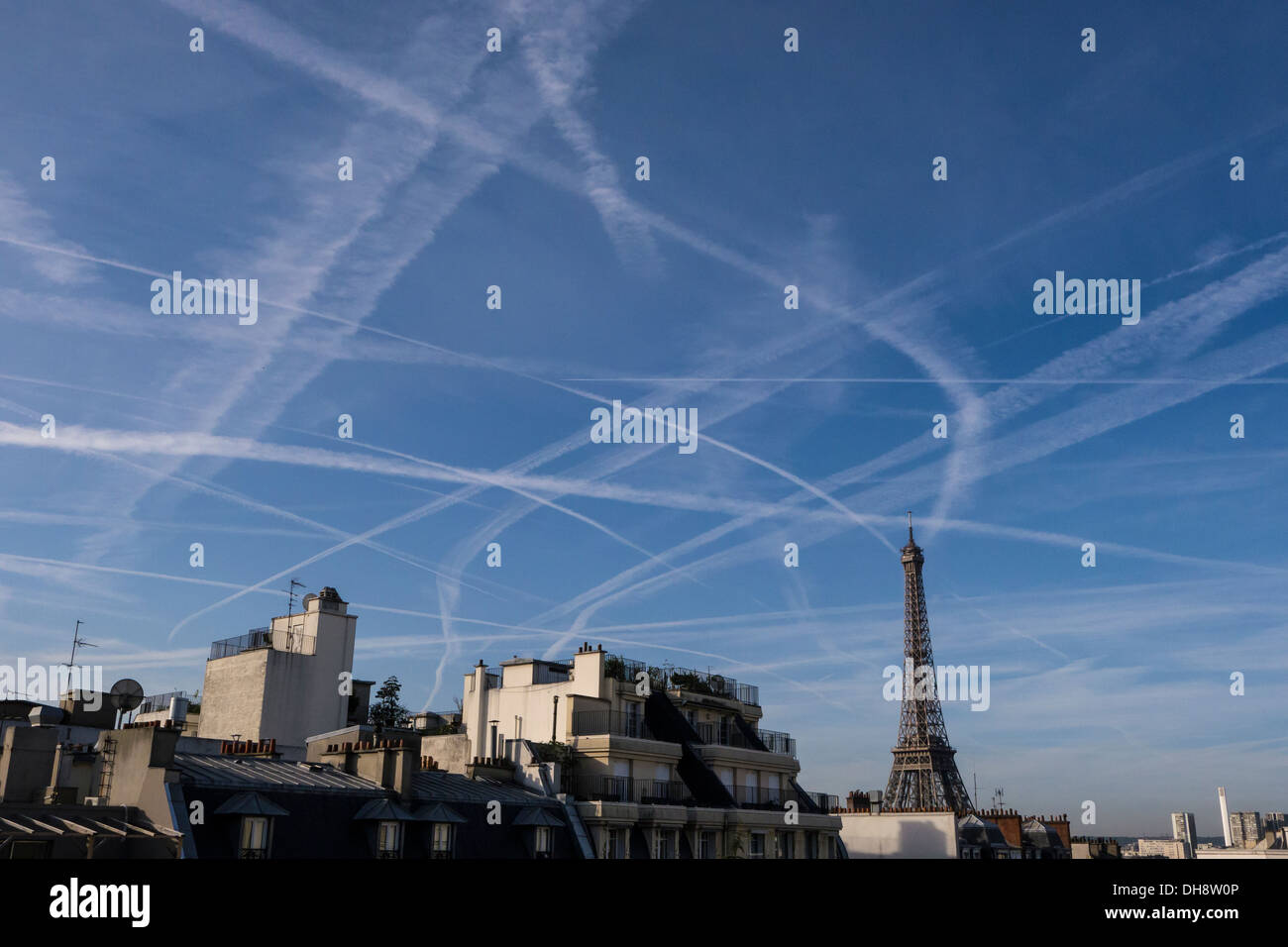 Eiffel Tower, with contrails Stock Photo