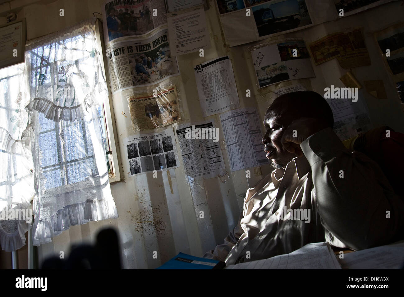 Bricks Mokolo sits in his office at the waste collection site. The 2010 FIFA World Cup in South Africa has seen the country Stock Photo
