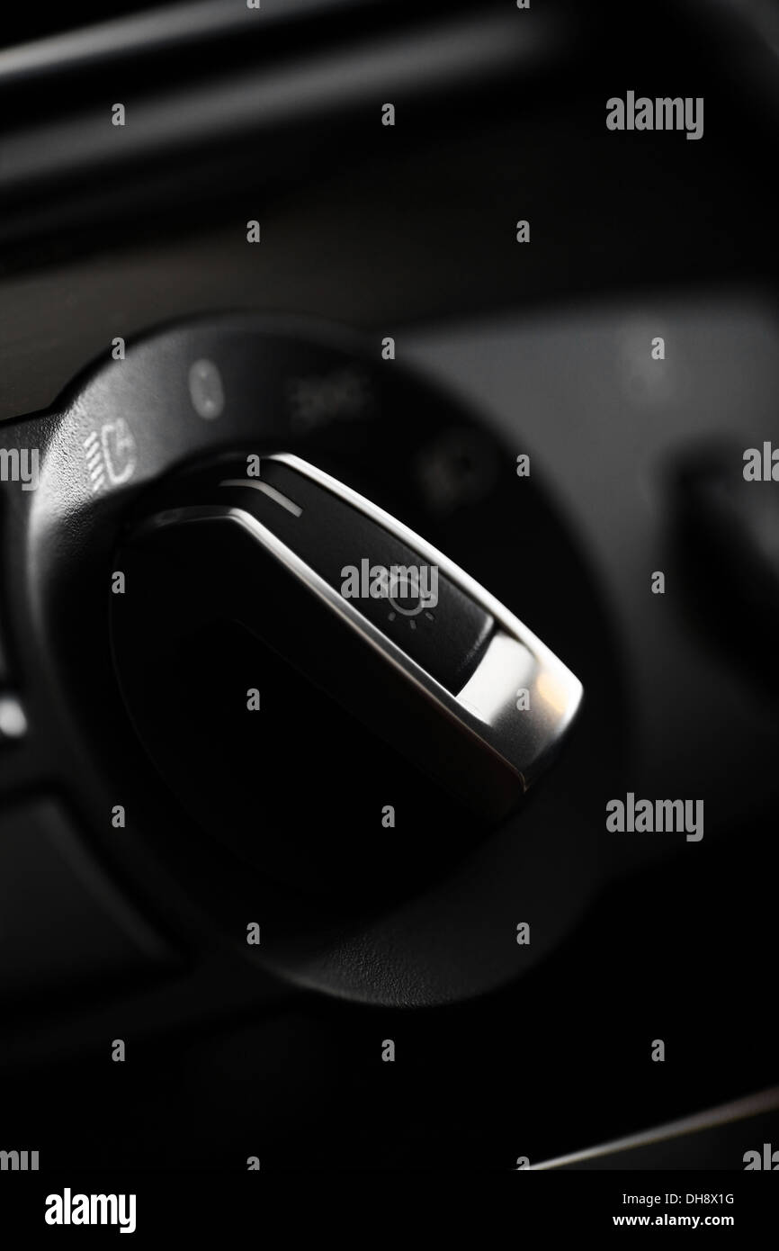Detail of the headlight button in a car Stock Photo Alamy