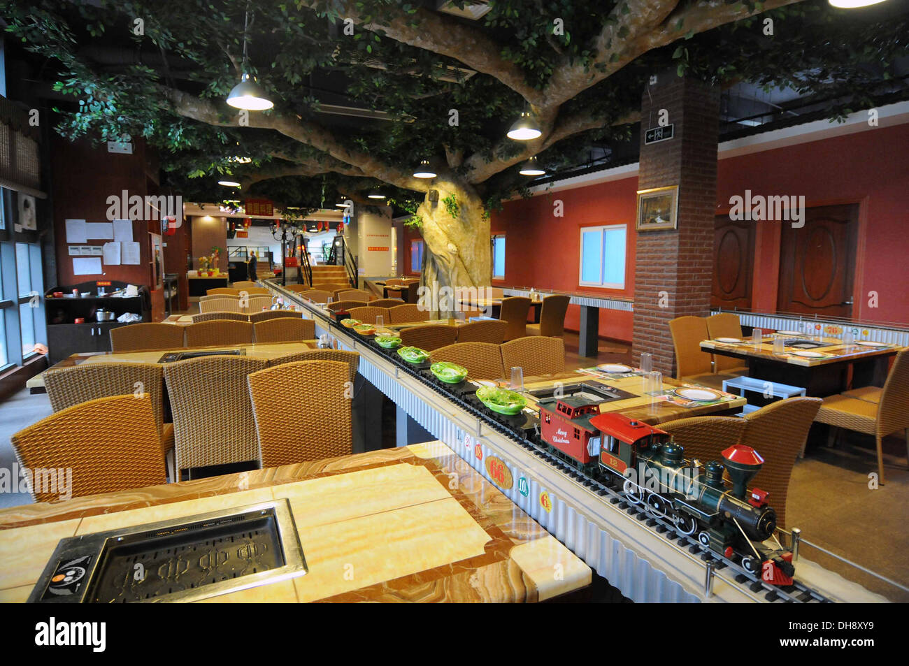 Choo-Choo Your Food! A railway-themed restaurant in Nanjing, China has replaced the standard conveyer belt method of choosing Stock Photo