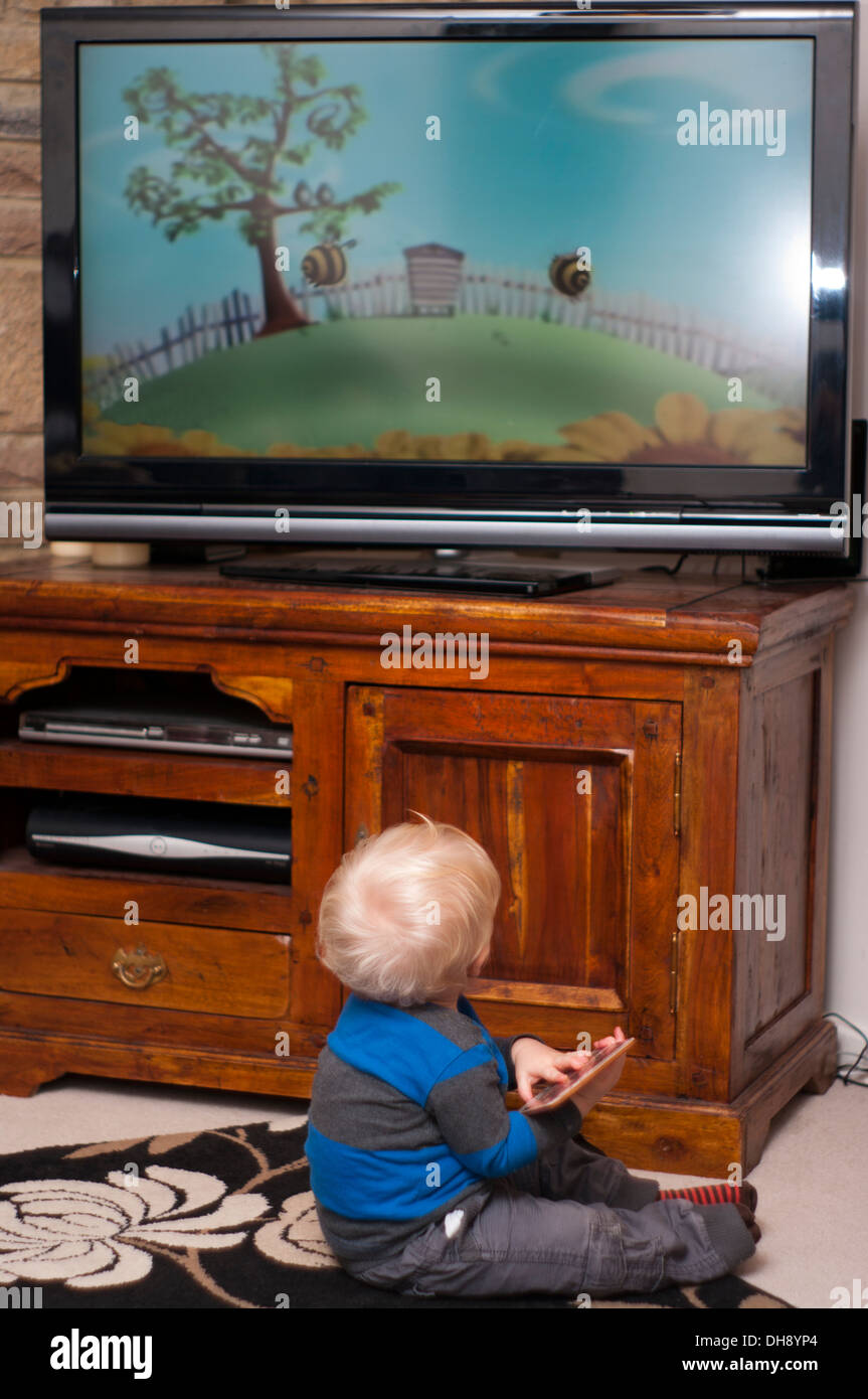 Baby Boy Watching Childrens Television Program (baby point of focus, TV