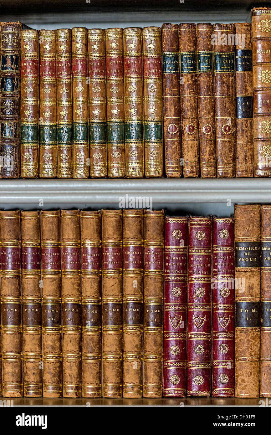 Old books arranged on shelving Stock Photo Alamy
