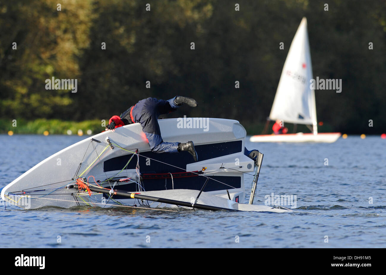 Single handed yachtsman sailing his boat Stock Photo Alamy