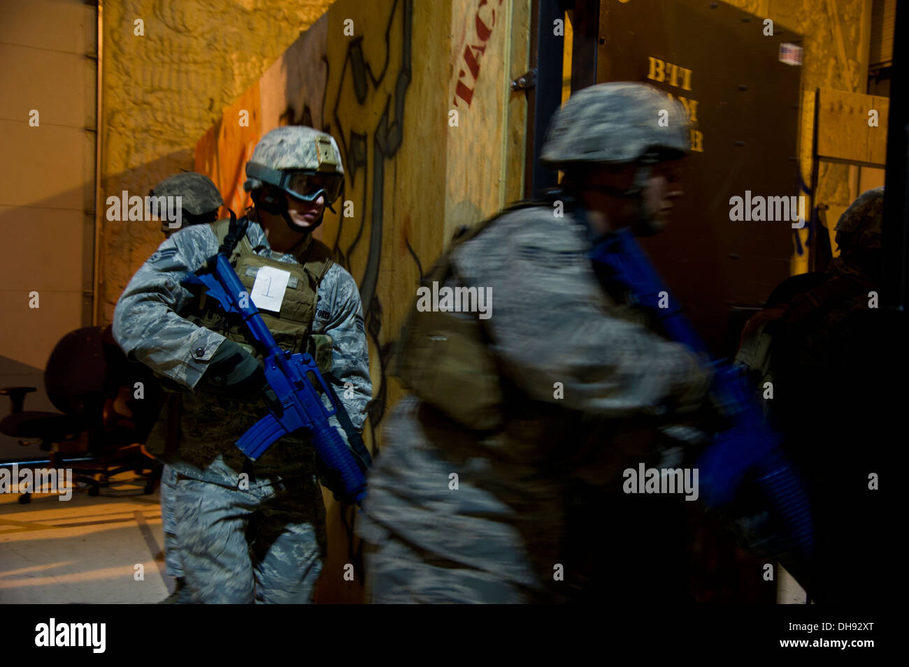 Senior Airman Derrick Besser, 791st Missile Security Forces member, performs close quarters battle glass house drills during the Stock Photo