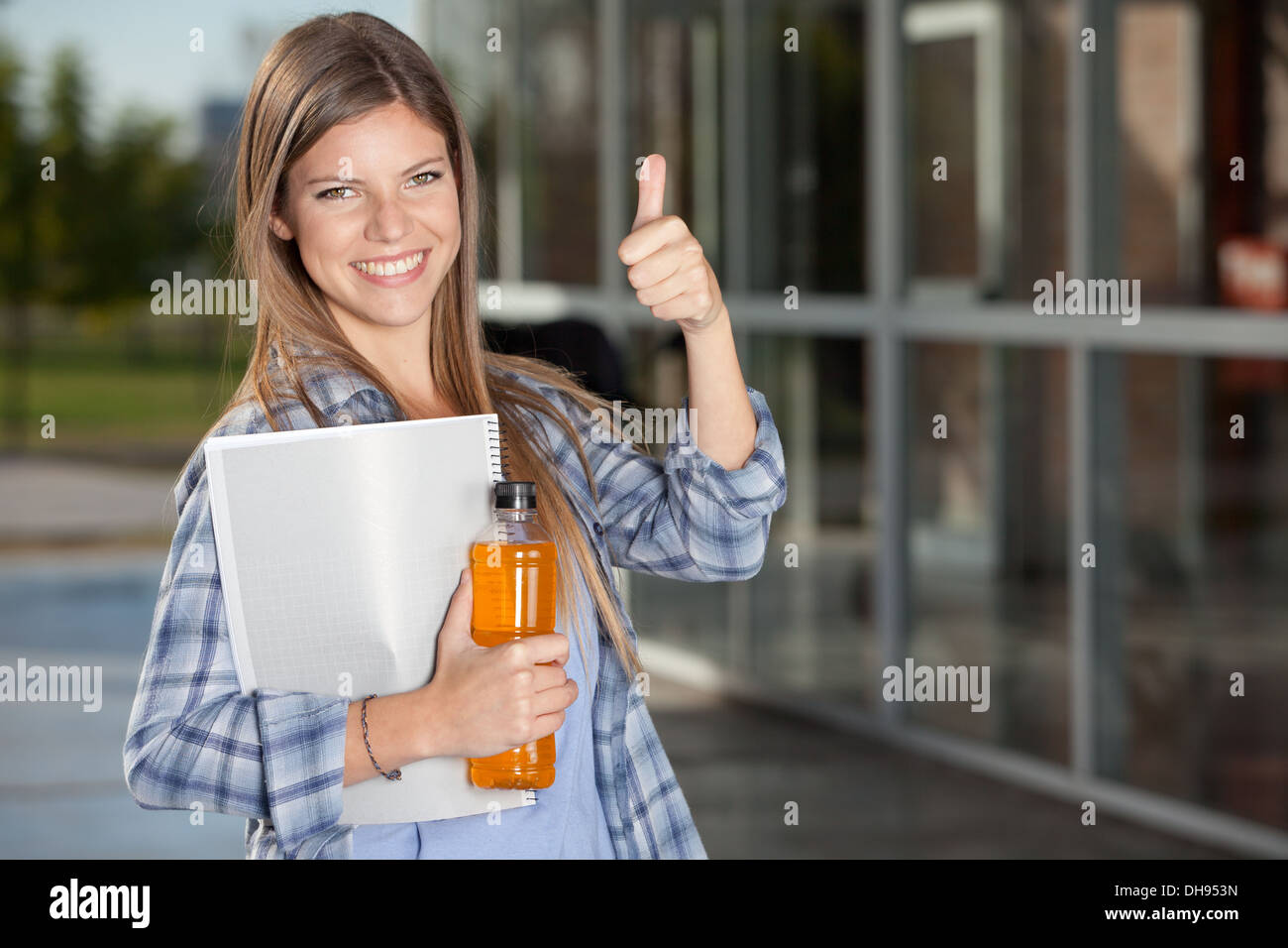 College Student Giving Thumbs Up Stock Photo - Alamy