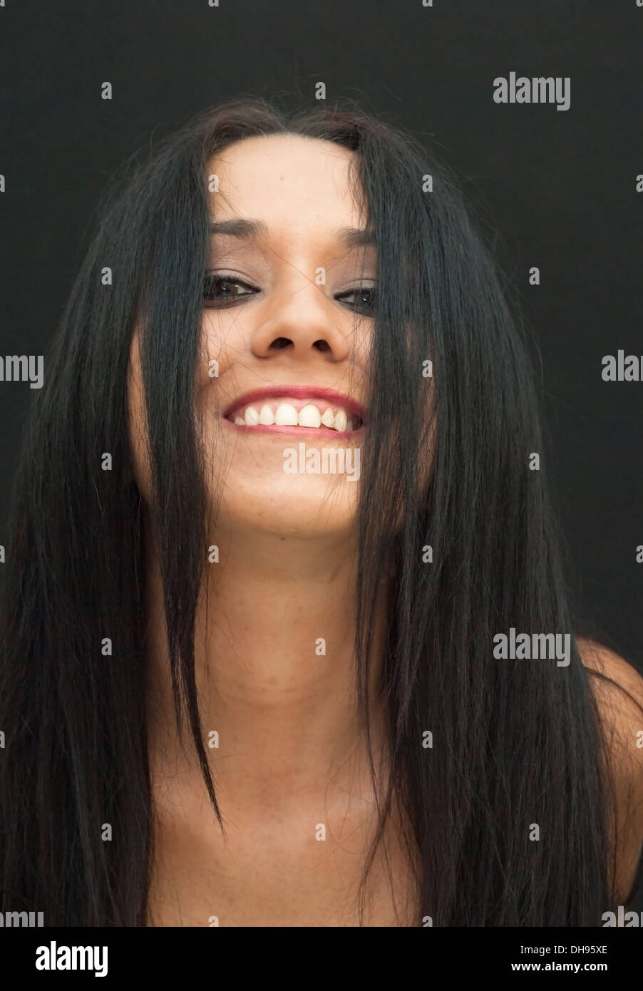 Portrait of an attractive woman on black background Stock Photo - Alamy