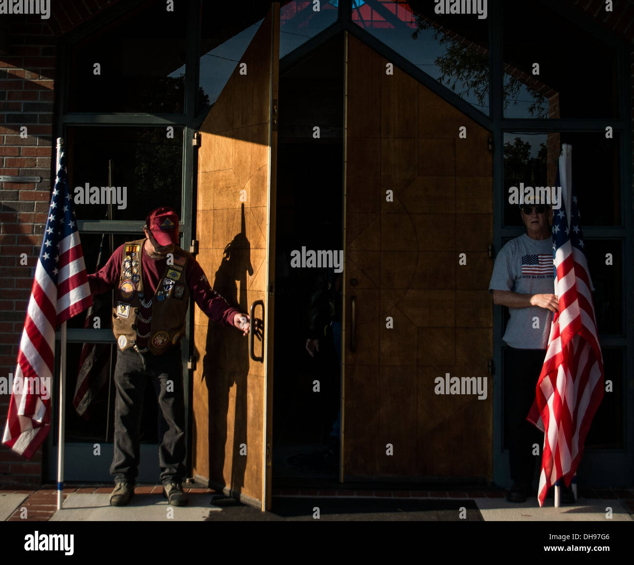 South Carolina Patriot Guard members open the doors to the Joint Base Charleston - Air Base Chapel during the memorial service of retired Master Sgt. Dave Williams Oct. 30, 2013. Williams served as the base multimedia manager and chief of internal. The Pa Stock Photo