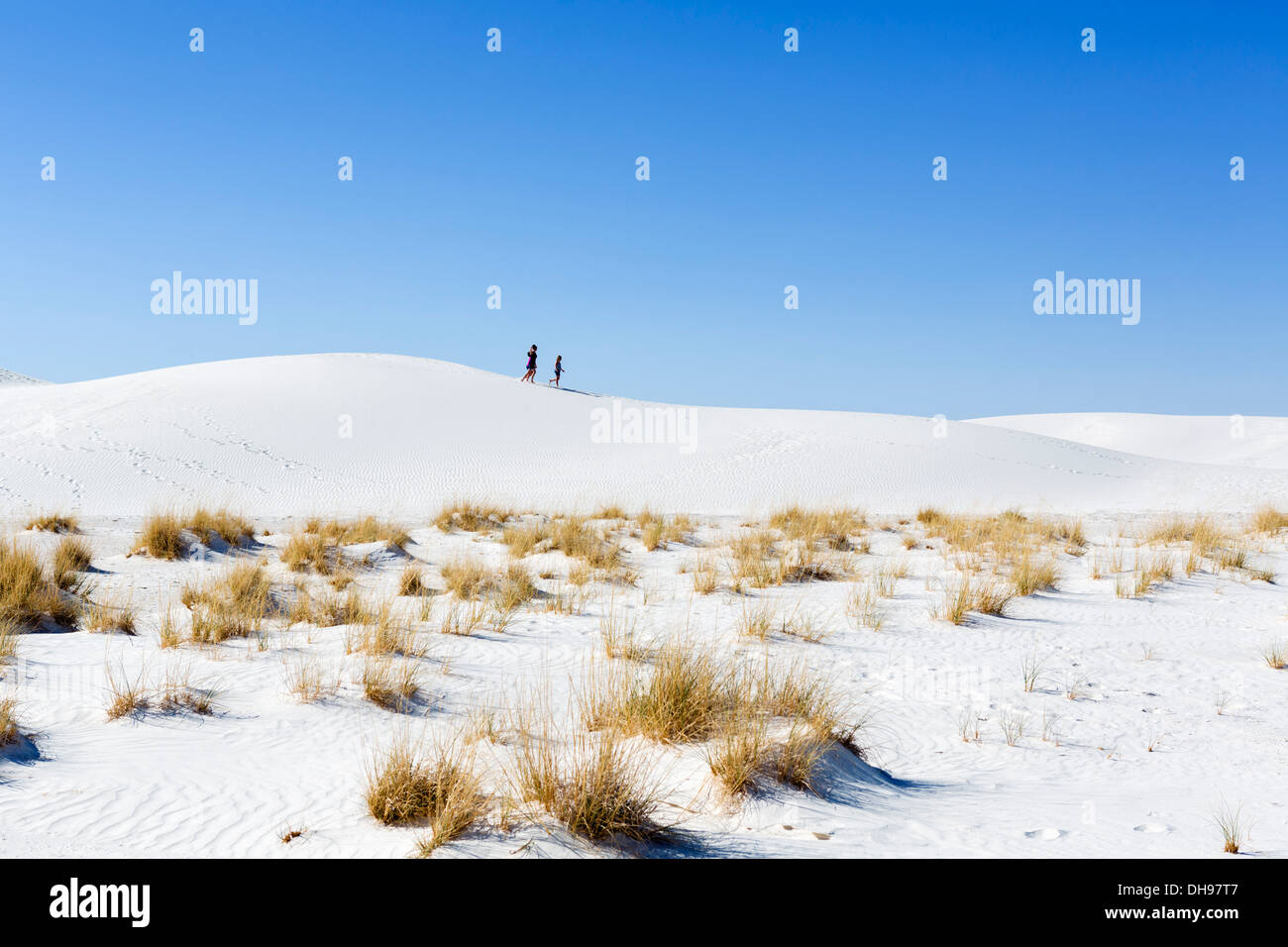 Walkers on the dunes at White Sands National Monument, near Alamogordo, New Mexico, USA Stock Photo