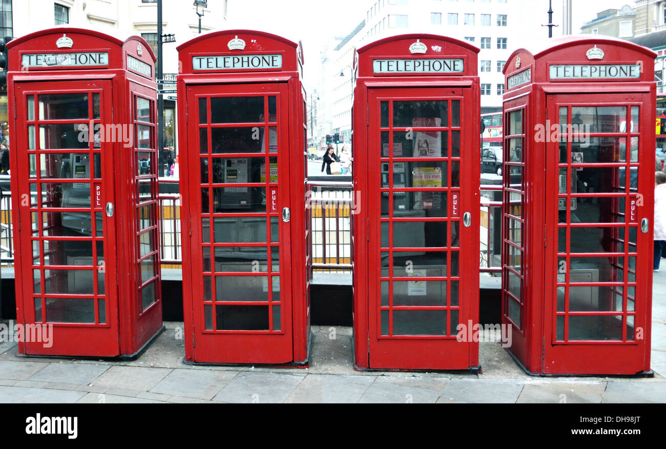 A line of four red london telephone boxes Stock Photo Alamy