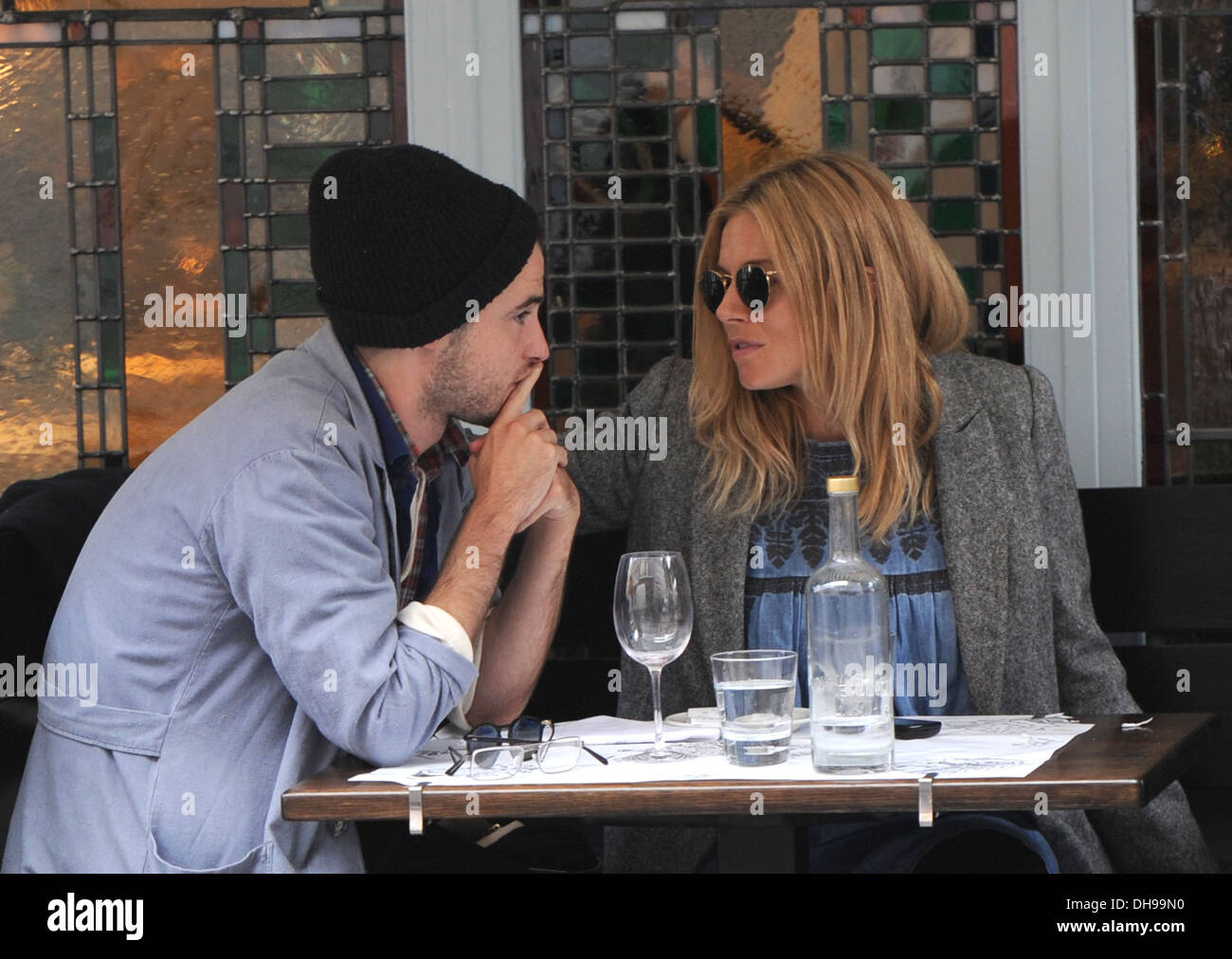 Pregnant Sienna Miller seen having lunch at a restaurant with her boyfriend  Tom Sturridge London England - 30.03.12 Stock Photo - Alamy