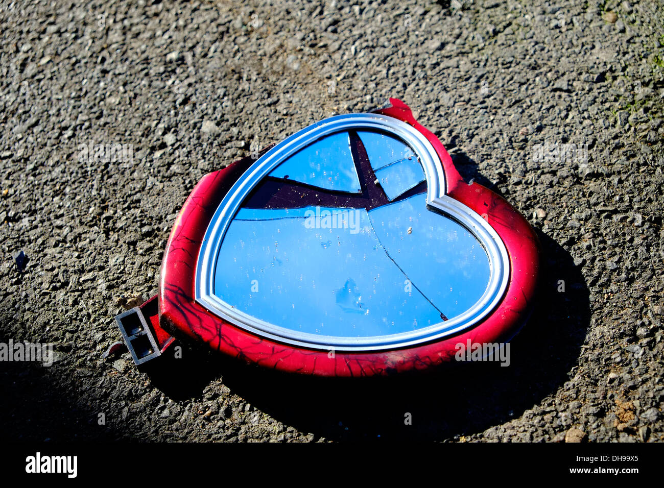 Broken mirror, heart shaped on pavement Stock Photo - Alamy, image size:1300x956