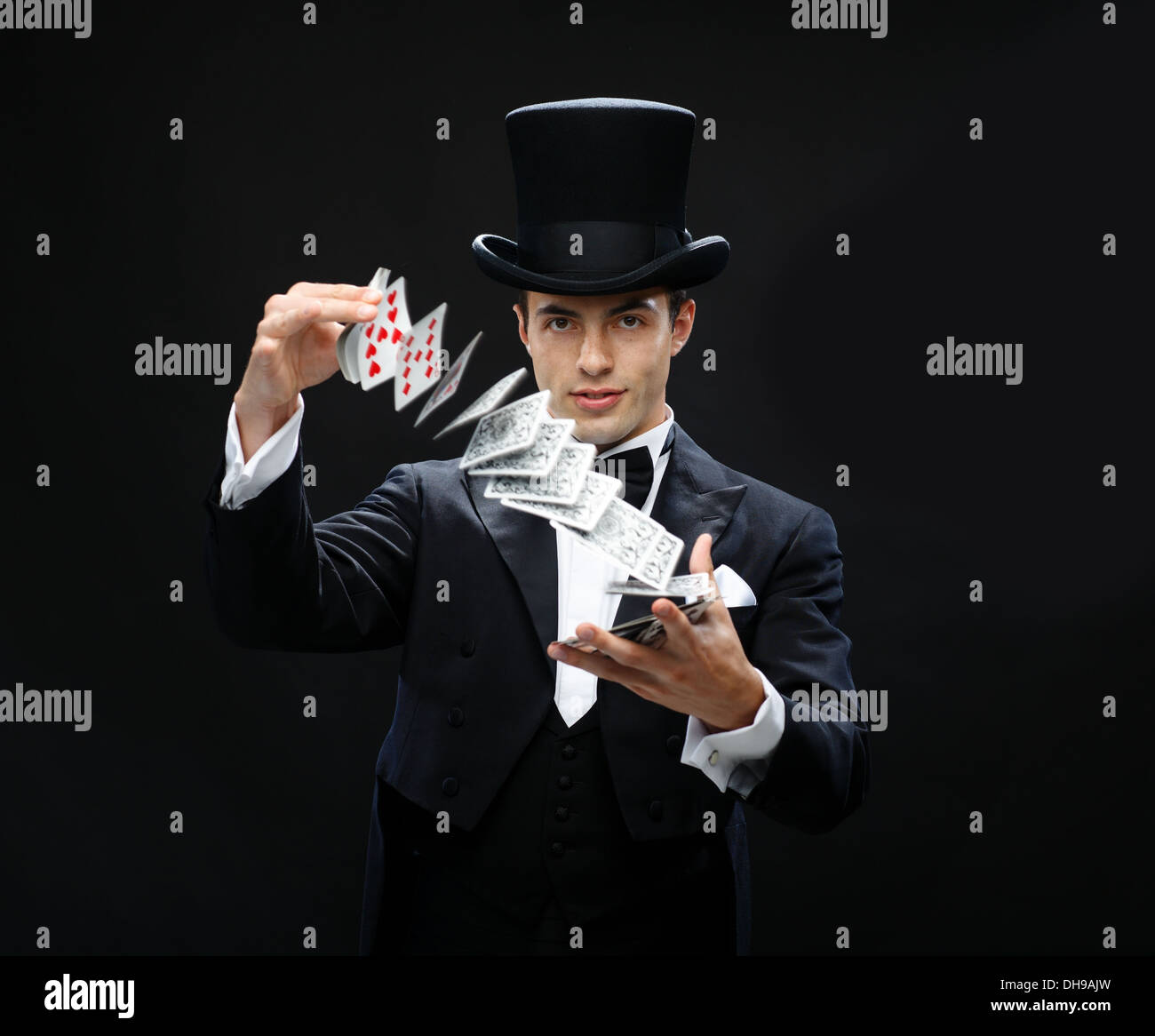 magician showing trick with playing cards Stock Photo Alamy