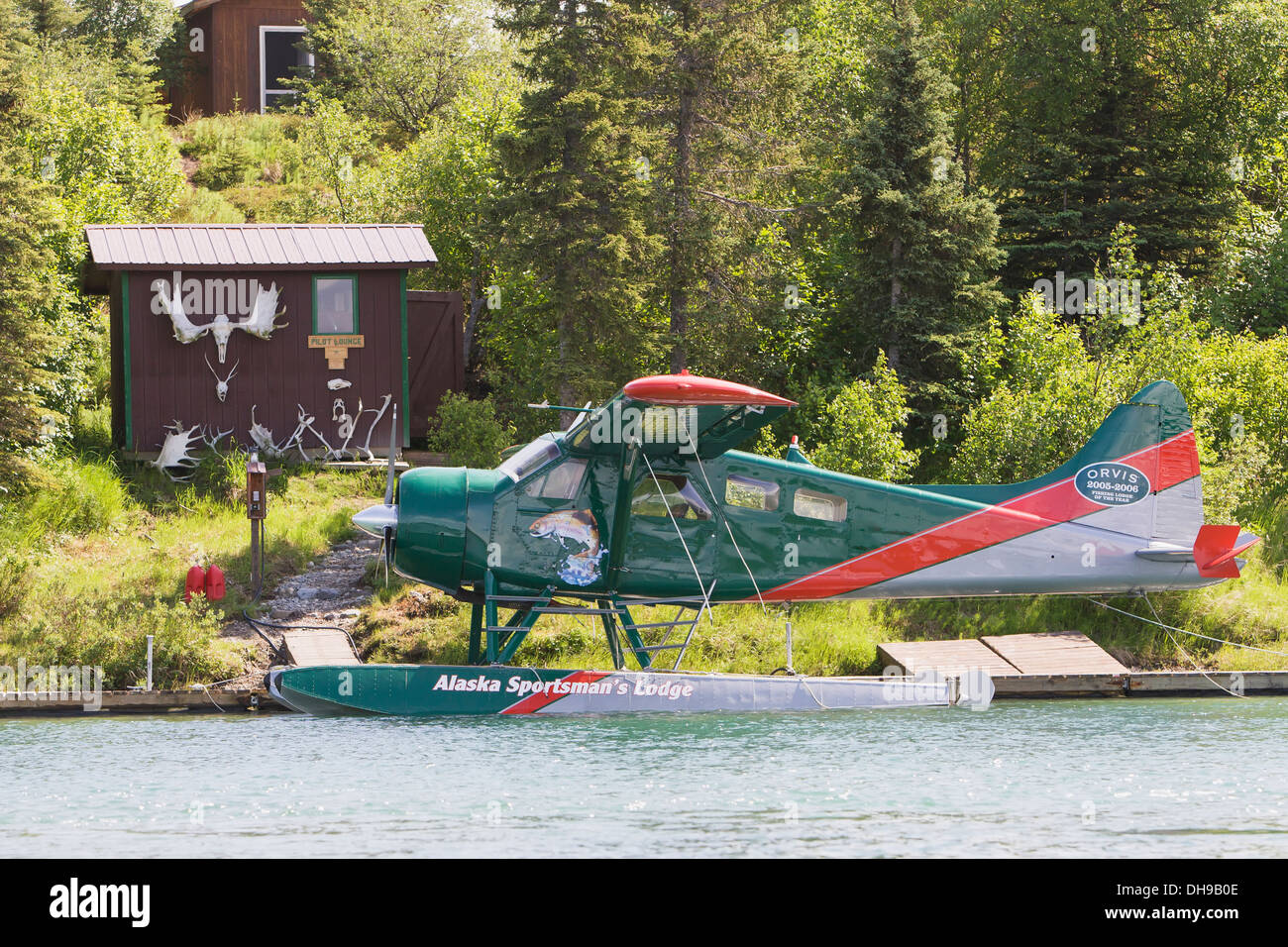 A Floatplane Docked In Front Of One Small Outbuilding Of The Alaska Sportsman's Lodge; Bristol Bay Alaska Stock Photo