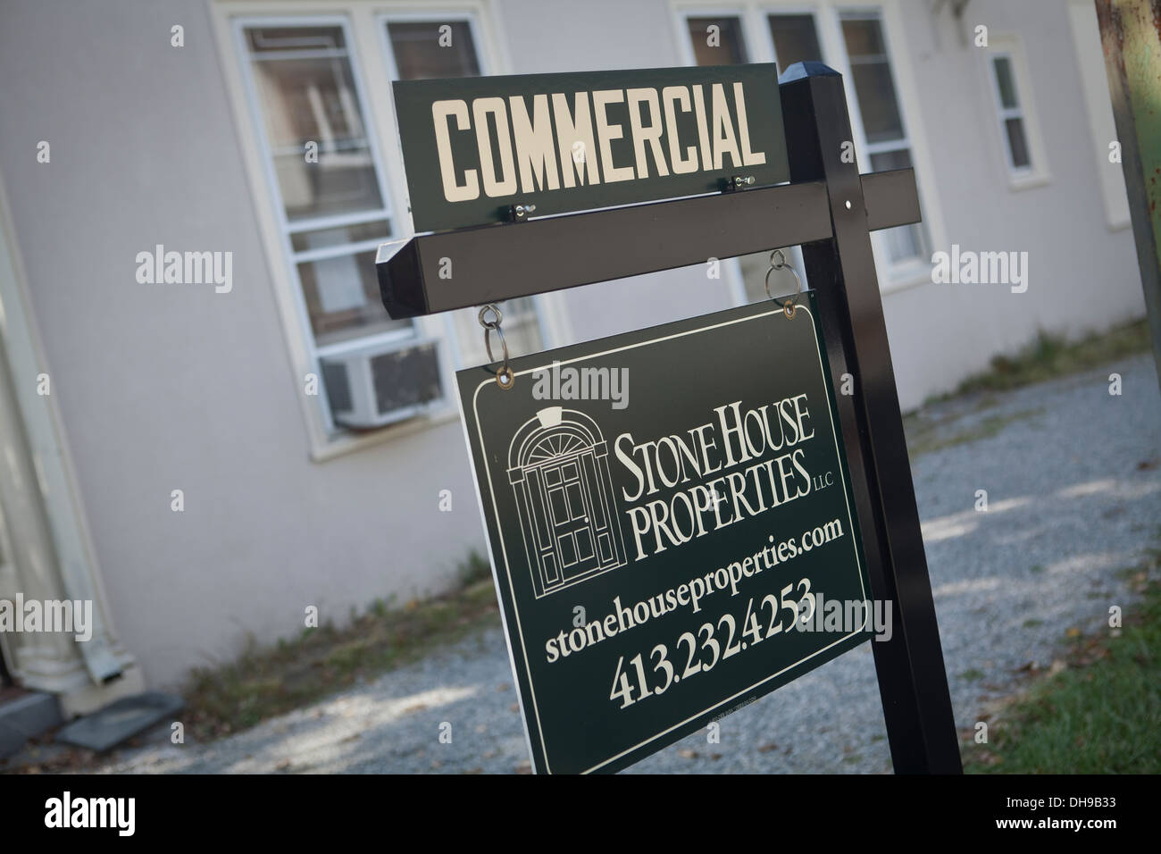 A Stone House Properties sign is pictured in front of a commercial