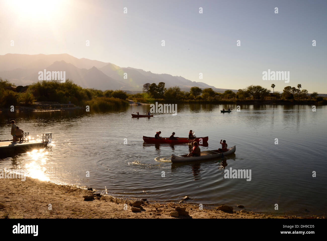 Campers canoe Roper Lake at Roper Lake State Park in Graham County
