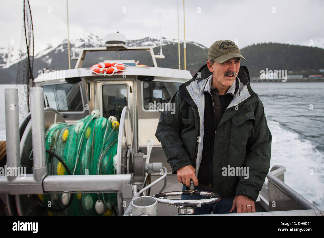 A Commercial Salmon Fisherman Drives His Bowpicker From The Steering Station Towards The Salmon