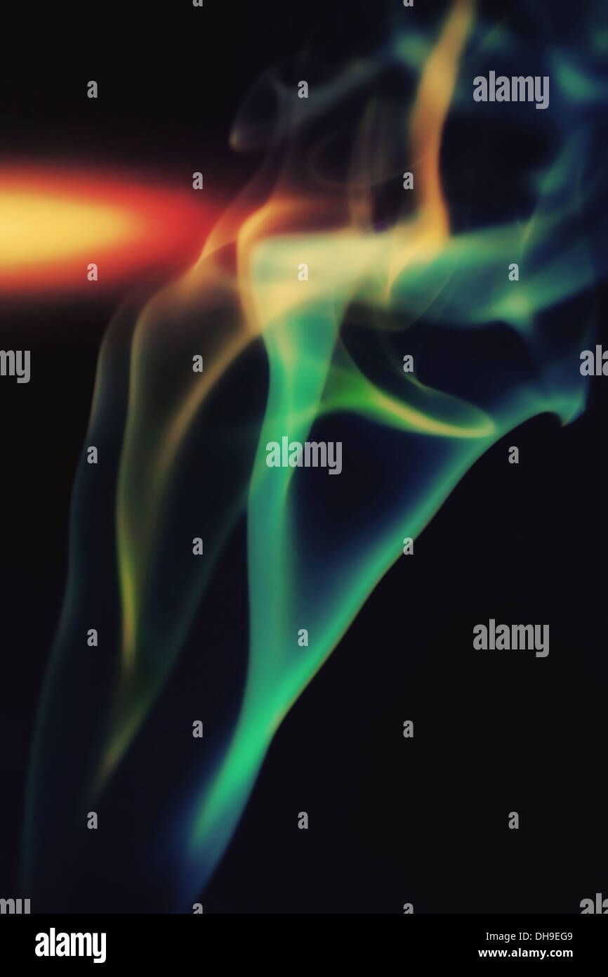 Abstract colorful smoke on a black background Stock Photo - Alamy