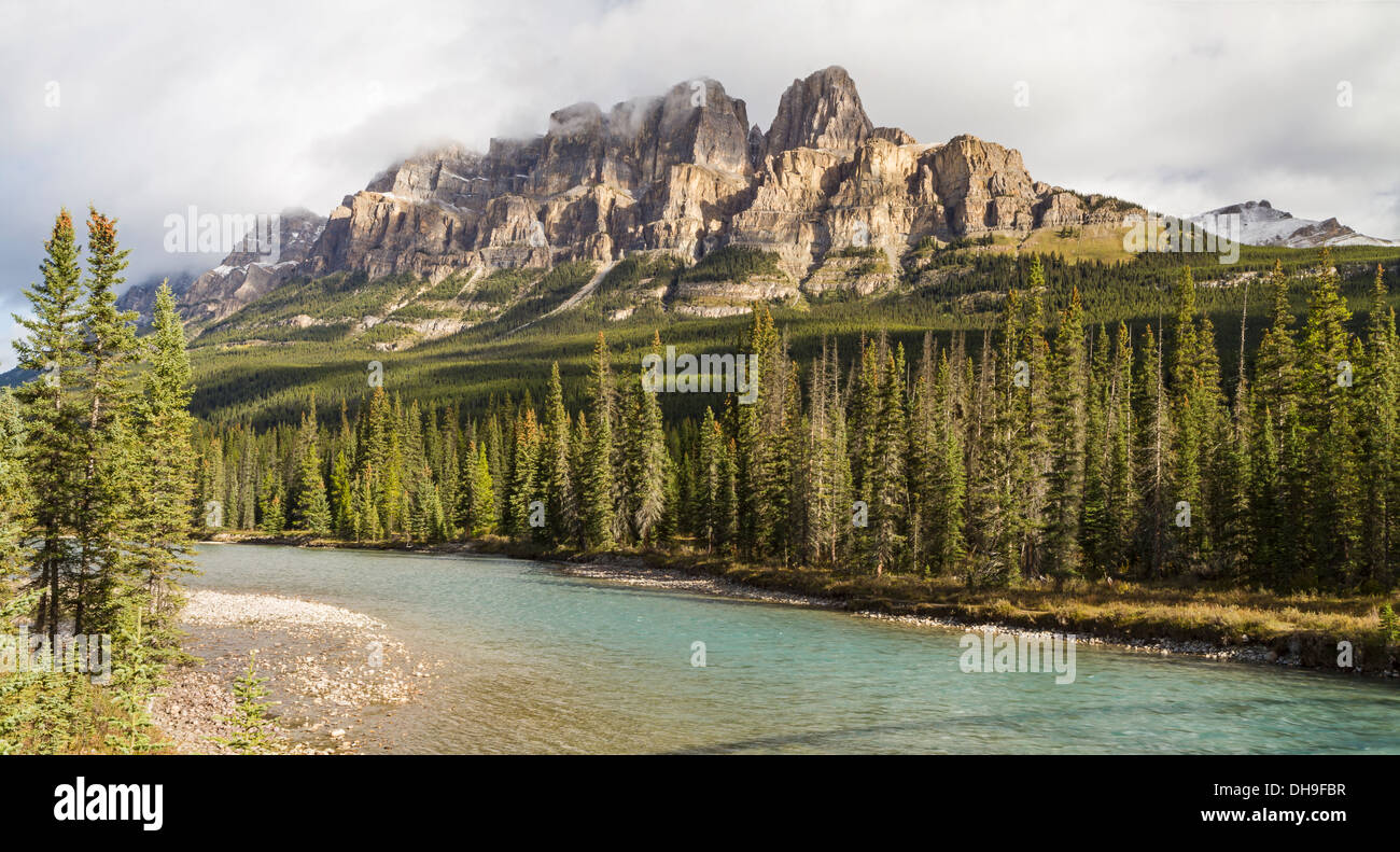 Castle Mountain emerges from the clouds above the Bow River in Banff National Park, Alberta (Panorama) Stock Photo