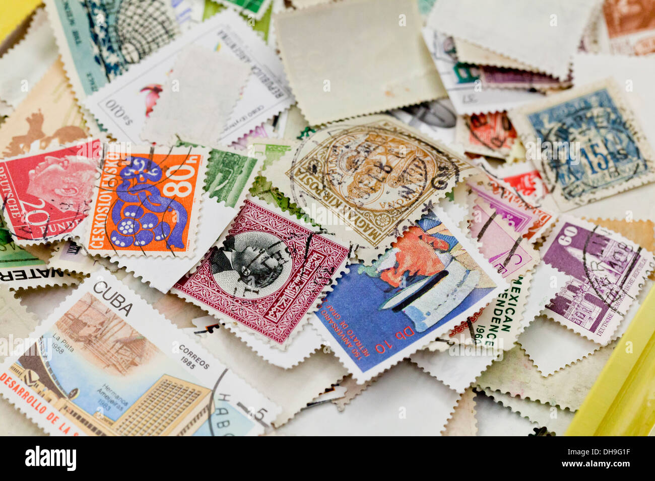 Used stamp collection in a pile - USA Stock Photo - Alamy