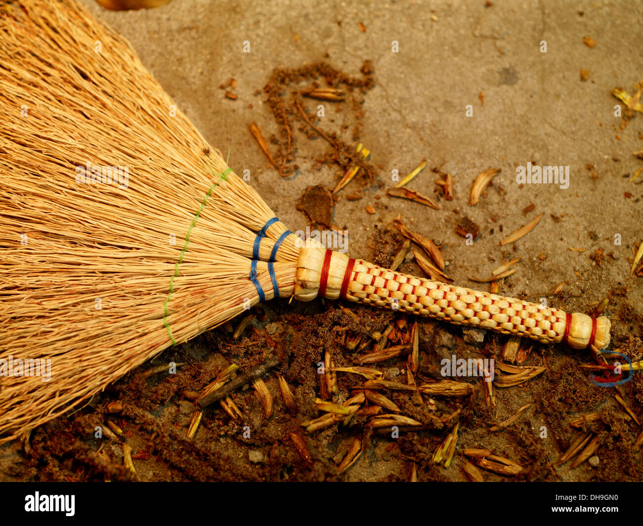 Straw broom on the floor Stock Photo Alamy