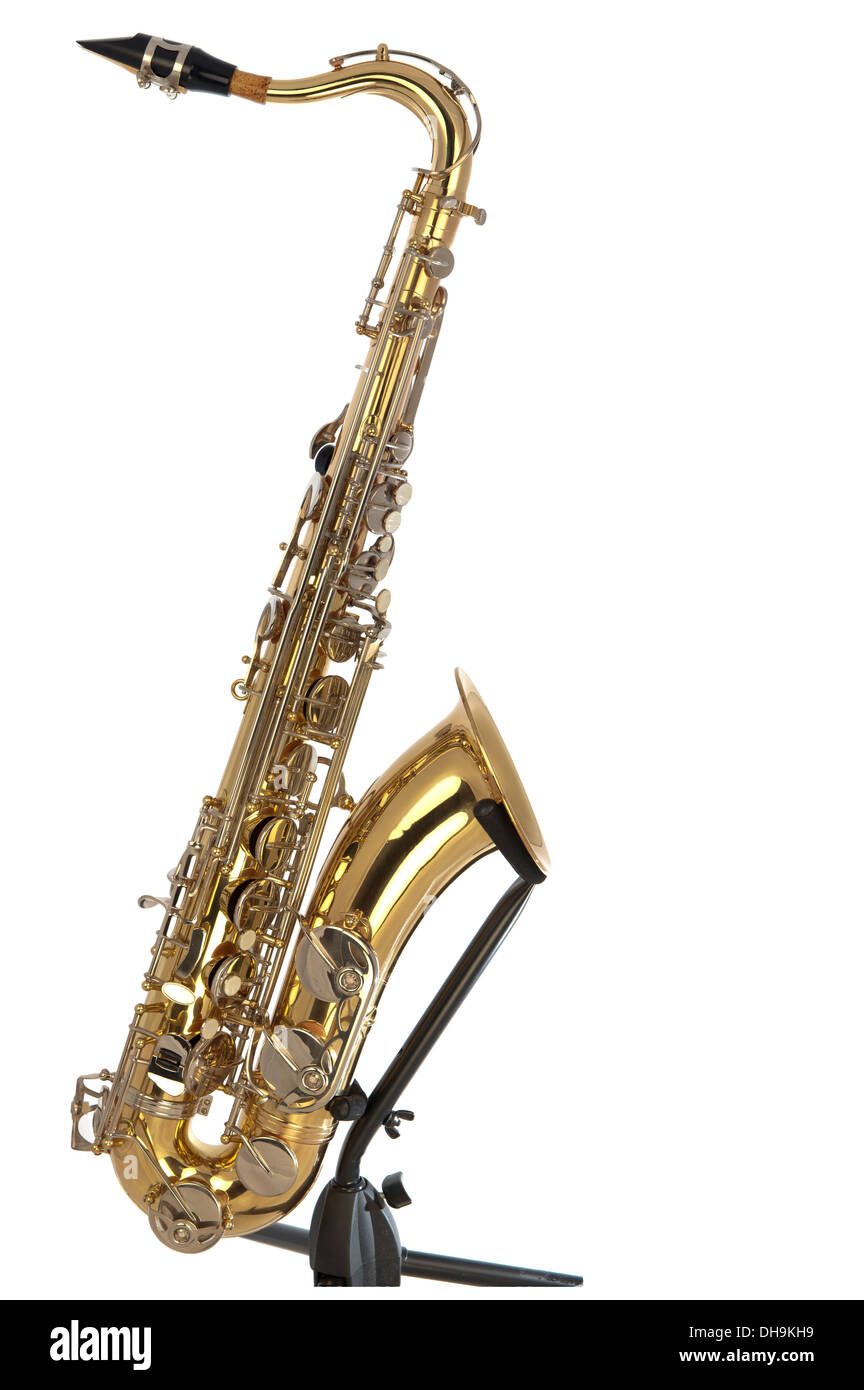 Brass tenor saxophone with silver valves and pearl buttons on a stand and in a boxed puzzle Stock Photo