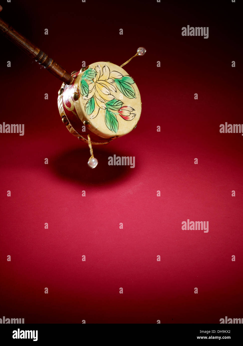 Rattle drum with floral pattern Stock Photo - Alamy