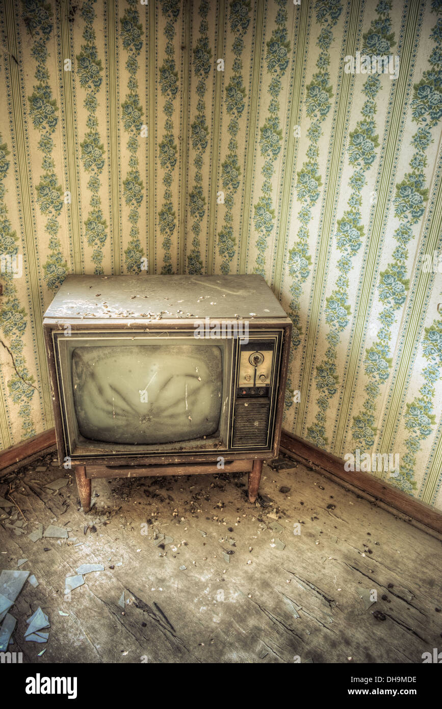 An abandoned television set in an abandoned rural home. Stock Photo