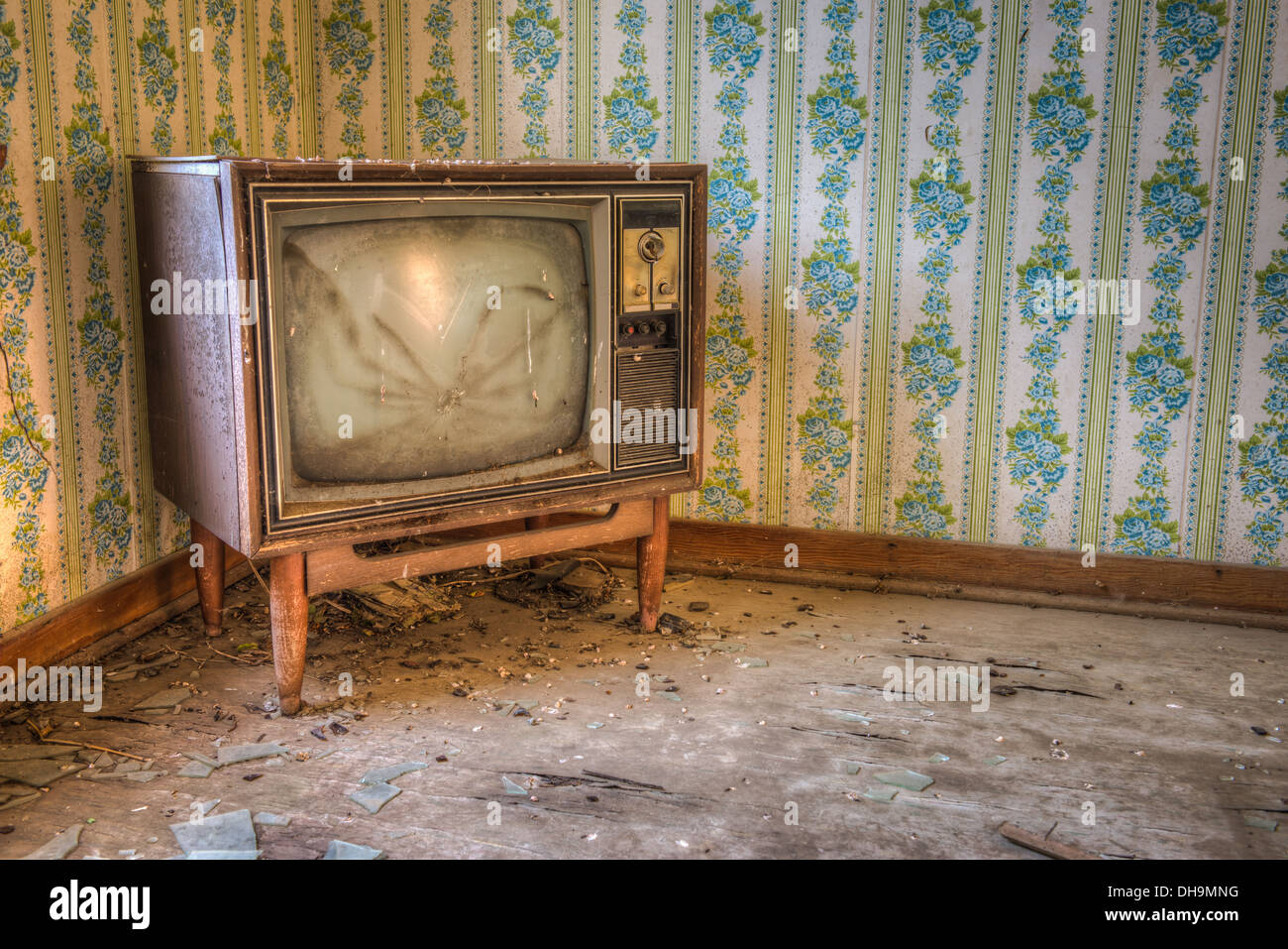 An abandoned television set in an abandoned rural home. Stock Photo