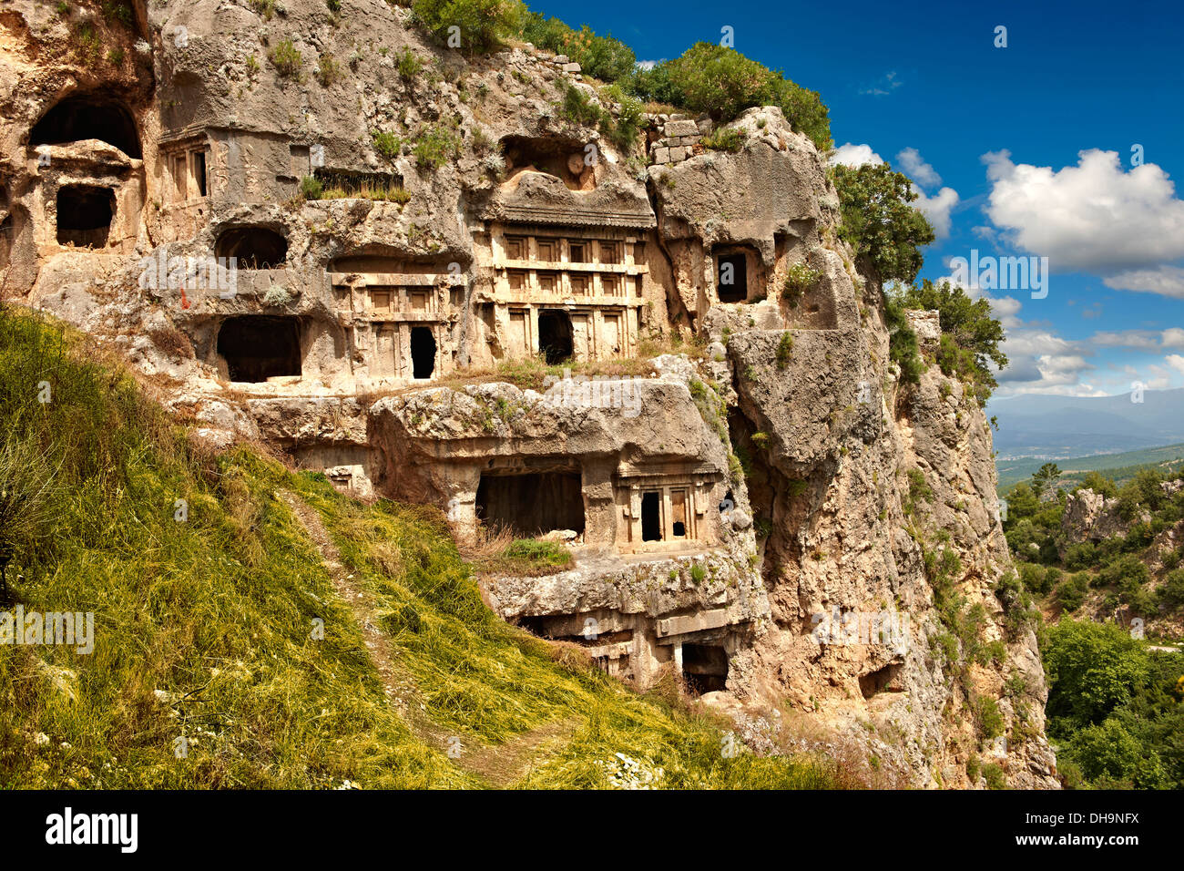 Tlos acropolis and Lycian house and temple-type rock-cut tombs. Tlos Turkey Stock Photo